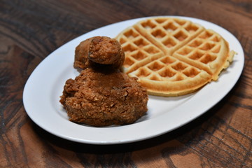 Crispy fried chicken bites with salad. Traditional american food.