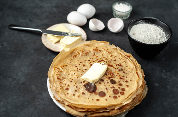 The recipe for making homemade pancakes from
flour, eggs, butter, milk, salt, sugar on a stone background with copy space for your text