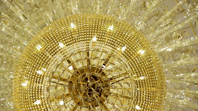 A beautiful Chandelier at a Restaurant. Could also be the Interior of a classy Bar or a Living Room.