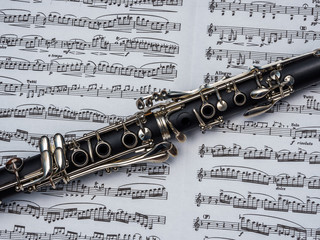 Cropped photo of clarinet over the notes