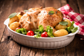 Roasted turkey garnished with potato and veg. Thanksgiving Christmas dinner. Chicken, roasted