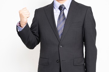 ガッツポーズをする男性