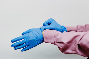 The guy puts on medical gloves