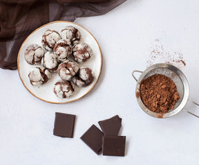 chocolate marble cookies brownie on table with ccocoa powder