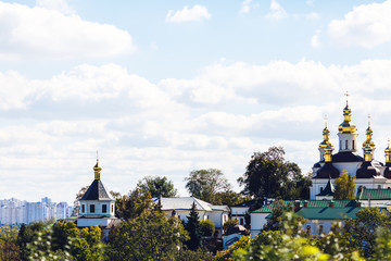 Fototapeta na wymiar Orthodox church against the sky in the city