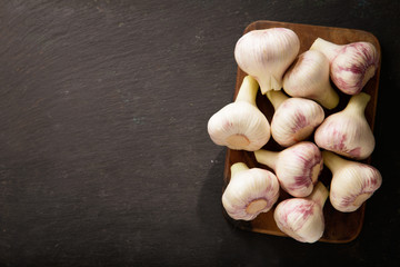 Fresh garlic on a wooden board