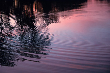 Sunset with ripples, rock throw