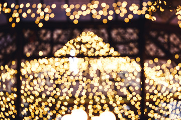 The gazebo is decorated with a luminous garland. Photo bokeh