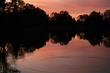 Sunset with ripples, rock throw