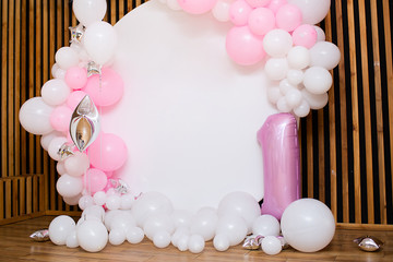 festive white photo zone with pink balloons. copy space