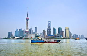 View of Sanghai skyscraper with river and boats