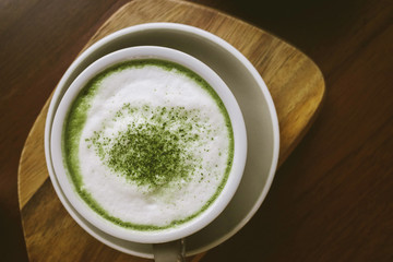 Green tea matcha on wooden table