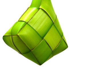 Ketupat or rice dumpling is a local delicacy during the festive season. Ketupats, a natural rice casing made from young coconut leaves for cooking rice on a white background
