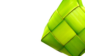 Ketupat or rice dumpling is a local delicacy during the festive season. Ketupats, a natural rice casing made from young coconut leaves for cooking rice on a white background
