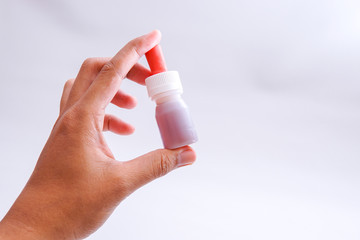 the bottle containing the vaccine in the hand