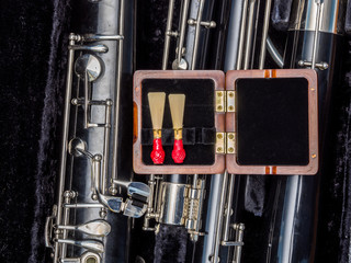 Old used bassoon parts unassembled in the case