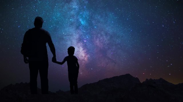 Man Father Showing Daughter Child Night Starry Sky In Mountains