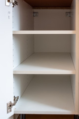 Empty kitchen cabinet showcasing corona crisis leading to shortage of food