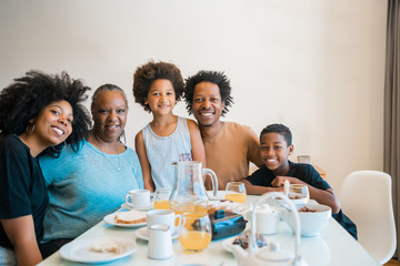 Family having breakfast together at home.