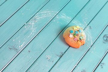 Home baking. Cookies with chocolate on a wooden table. Boards painted in turquoise color.