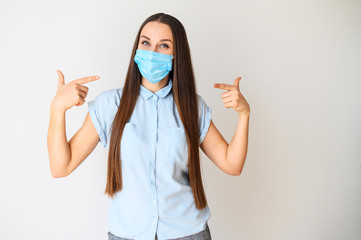 Positive young woman in medical mask