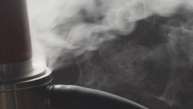 Close-up view of hookah shisha with blowing smoke in hookah bar