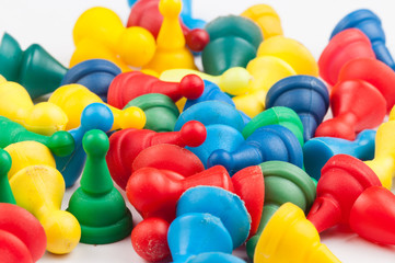 Colorful play figures with dice isolated on white background.Copy space