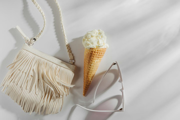 Small white bag with fringe and ice cream. Summer Vacation concept.