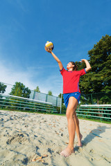 Young professional female volleyball player in an action.