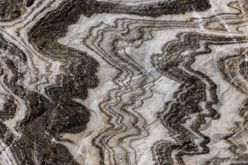 Abstract gray texture of natural, raw salt in an underground salt mine