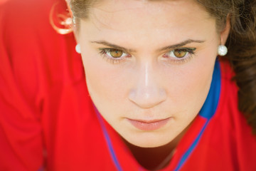 Close up portrait of young female professional volleyball player.Lens flare