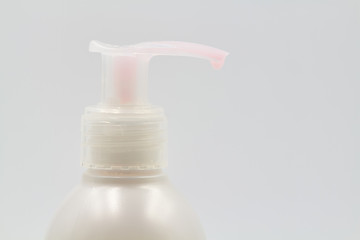Fototapeta na wymiar Liquid soap dispenser on light background. Hygiene to protection from Covid-19. Coronavirus prevention. Closeup