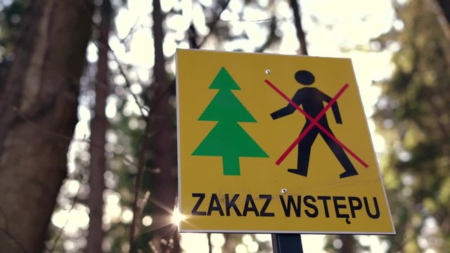Return of communism in Poland. Information plate with a sign prohibiting entry into the forest. The ban does not comply with the Polish constitution.  PIS violates human rights during the coronavirus 
