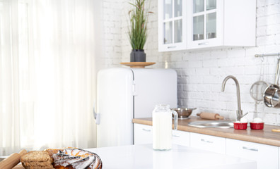 Home kitchen interior with fresh pastries on the table.