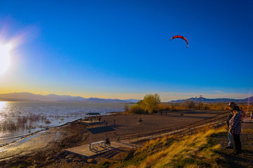 kitesurfing in Utah Lake at sunset