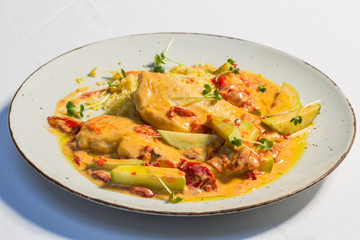 Chicken zucchini couscous served on a restaurant table