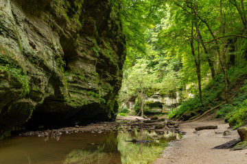 Naklejka na ściany i meble Exploring the canyons in the Lower Dells at Matthiessen State Park, Illinois.