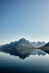 Fototapeta na wymiar Mountains reflection in tasermiut fjord