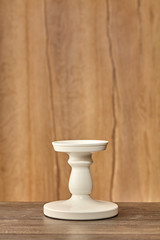 Empty stand on wood table with background. Close up