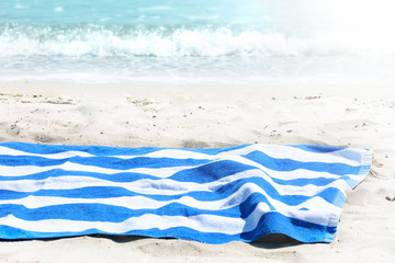 Beach towel on sand sea view background empty space display,tourism jorney backdrop.