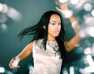 Naklejka premium fashion portrait beauty ice lady splashes of light in studio, creative make up christmass