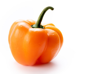 Orange Bell Pepper that look like a pumpkin on white