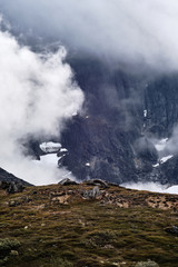 Mountains with cloud or fog covering 
