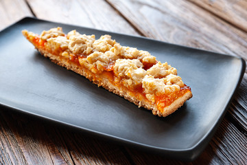 Homemade apricot pie. A slice of rustic sweet cake.