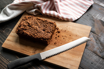 Fresh Baked Bread on Rustic Table with Knife