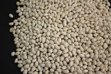 White grains on a scattered black textured background