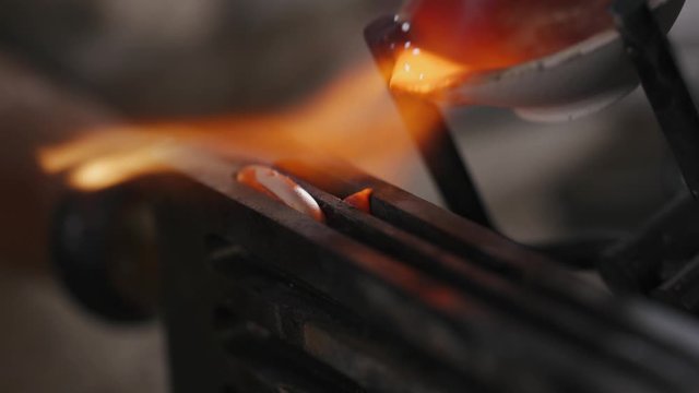 Gold melting the hot stove in jewelry factory hot jewel master in workshop. melt scrap rings