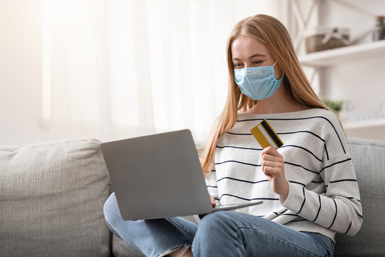 Young Woman In Protective Mask Buying Goods Online