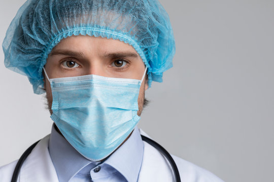 Portrait Of Confident Infectious Disease Doctor In Mask And Bouffant Cap