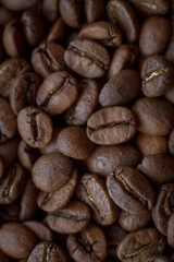 Extremely close-up background roasted coffee beans with gold streaks, good morning concept